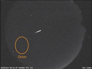 An Orionid meteor streaks overhead with the Orion constellation in the background in this NASA all-sky image during in 2015. The 2017 Orionid meteor shower peaks on Oct. 20 and 21.