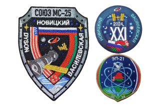 three spaceflight patches sit against a white background