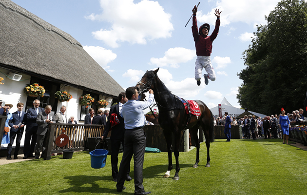 NEWMARKET, ENGLAND - JULY 09: Frankie Dettori riding Mr Singh celebrates winning The Bahrain Trophy at Newmarket racecourse on July 09, 2015 in Newmarket, England. (Photo by Alan Crowhurst/Getty Images)