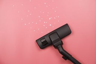 Vacuum cleaner on a pink background