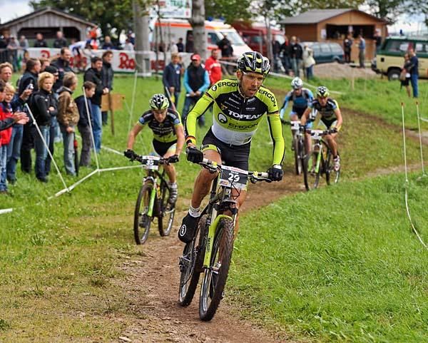 Wolfram Kurschat leads three other men.