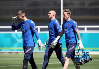 England goalkeepers Dean Henderson, Sam Johnstone and Jordan Pickford head out to training at St George's Park