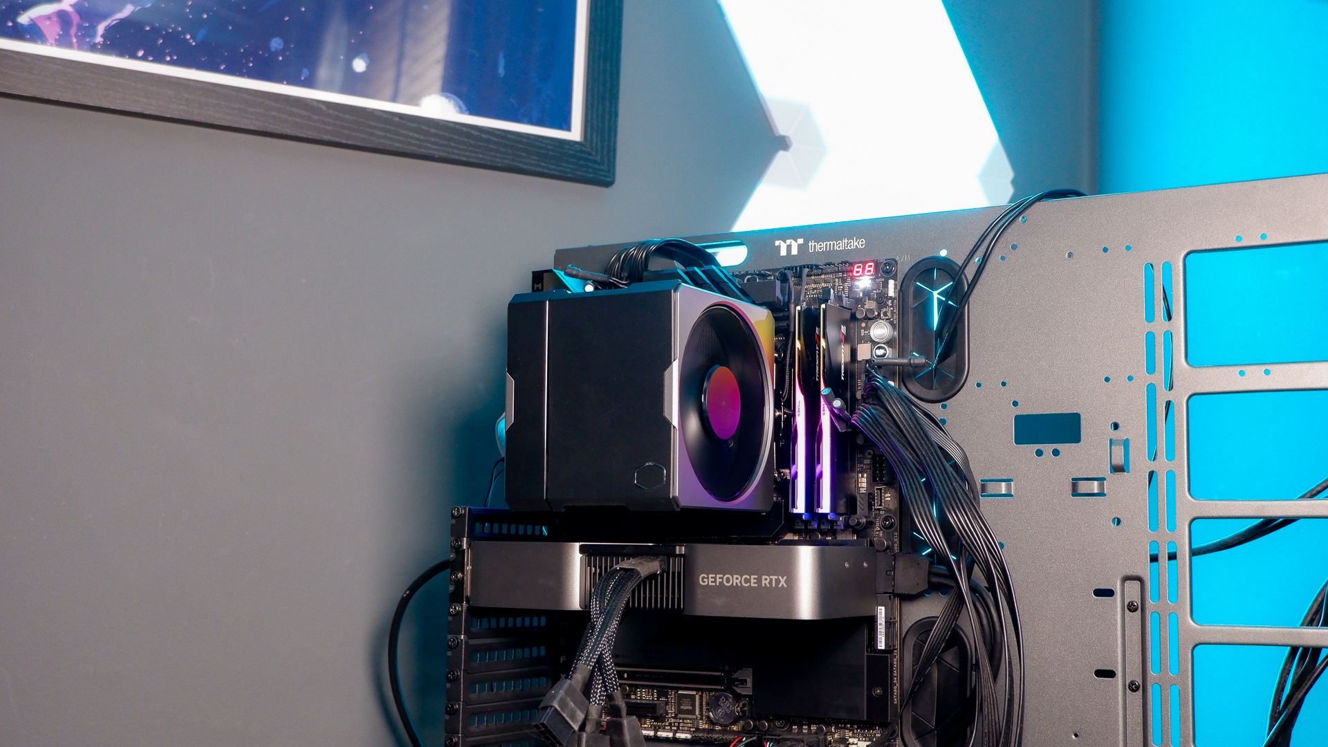 A Cooler Master Hyper 612 Apex on a desk and installed on a gaming PC.