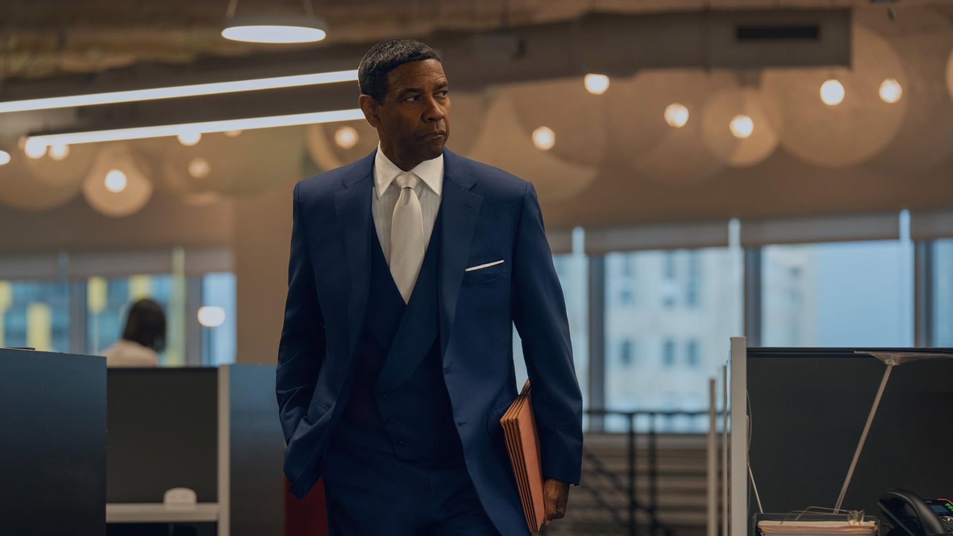 an image of denzel washington in character in highest 2 lowest wearing a blue suit
