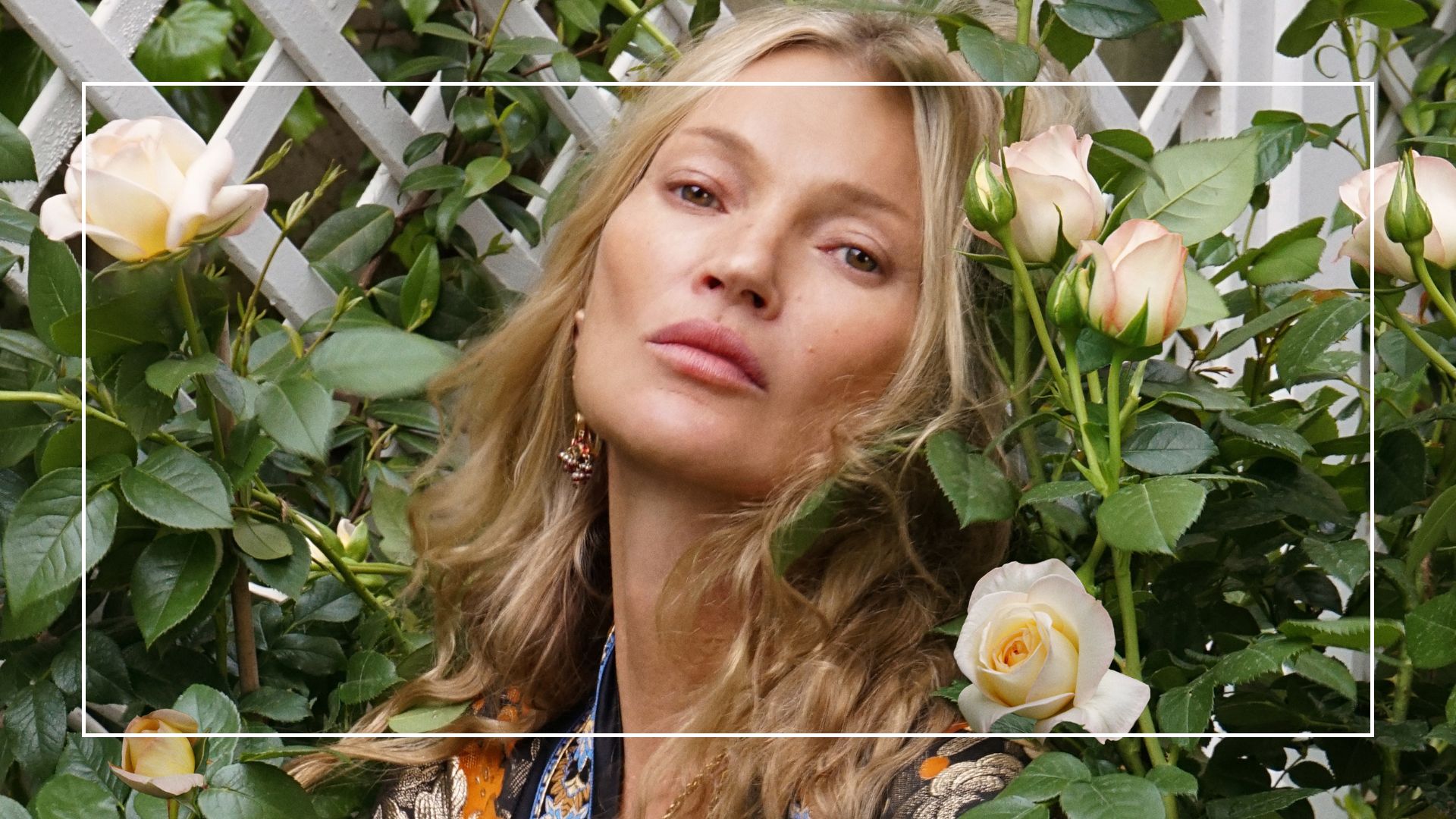 Headshot of Kate Moss surrounded by the Kate Moss Rose at RHS Chelsea Flower Show 2026