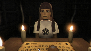 Girl sat at a table with candles and an ouija board