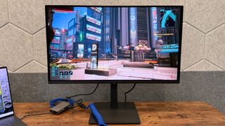 Alienware AW2726DM on a desk.