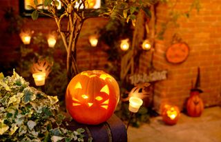 Light pumpkins outside a house on Halloween