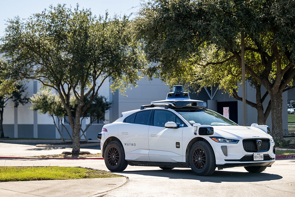 AUSTIN, TEXAS - JANUARY 15: A Waymo vehicle exits a charging lot on January 15, 2026 in Austin, Texas. Waymo is now servicing 140 square miles of Austin. The expansion comes amid ongoing competition between Tesla Robotaxis. (Photo by Brandon Bell/Getty Images)