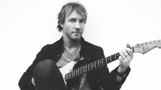 Kenny Wayne Shepherd black and white portrait as he plays an electric guitar