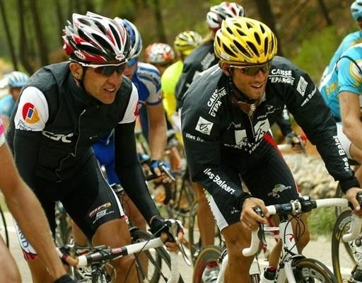Carlos Sastre (CSC) chats to Alejandro Valverde during stage 12