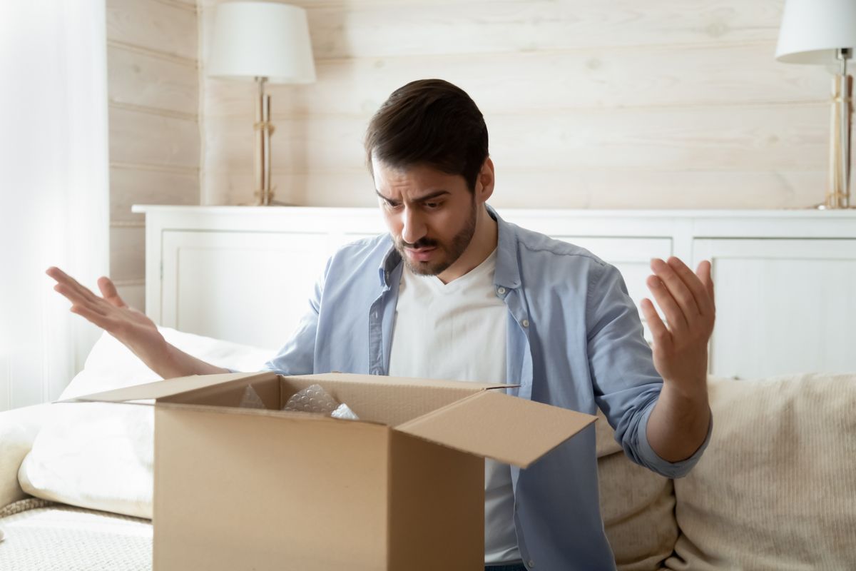 man opens a crap gift