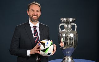 Gareth Southgate stood next to the European Championship trophy