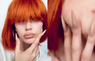 Model Kaia Gerber in a short red wig