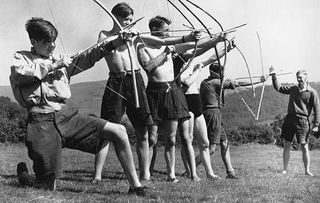 7th August, 1940: Boys from Birmingham Central Grammar School practice their archery skills with home-made bows and arrows in the Black Mountains. (Photo by Maeers/Fox Photos/Getty Images)