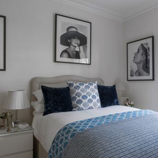 double bedroom with photoframes on white walls
