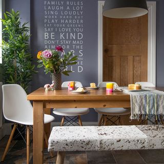 dining area with dining table and chairs and bench
