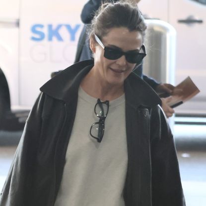 Keri Russell at the airport after the 2026 Golden Globes wearing chunky New Balance sneakers