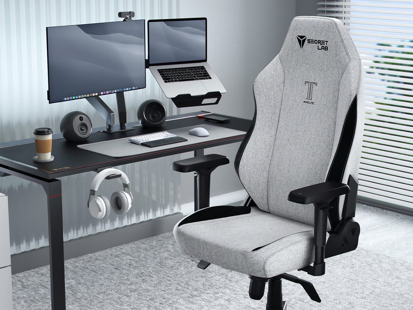 Secretlab's latest gaming chair, the Titan Evo Lite, in front of a gaming PC setup.