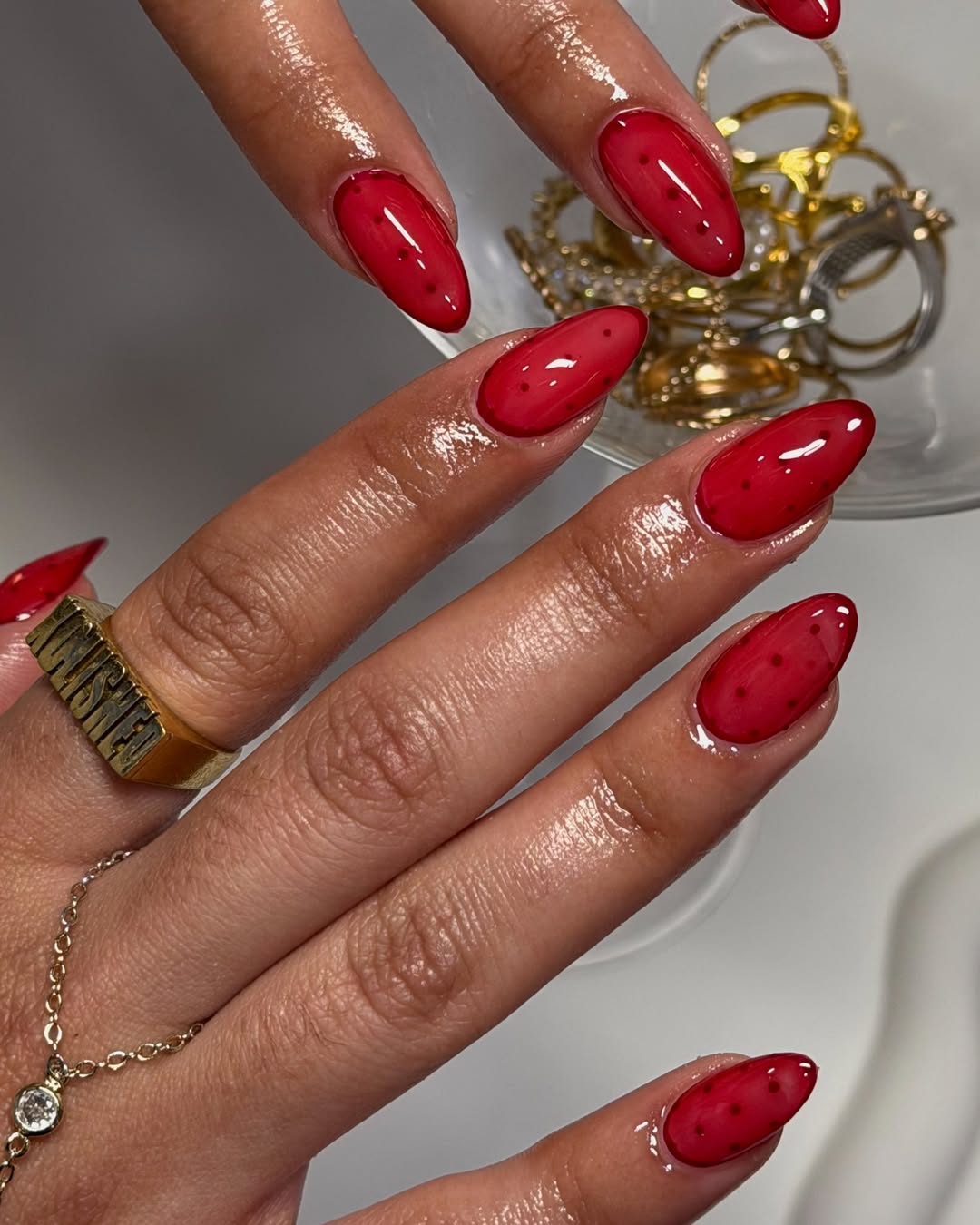 red jelly nails with polka dots