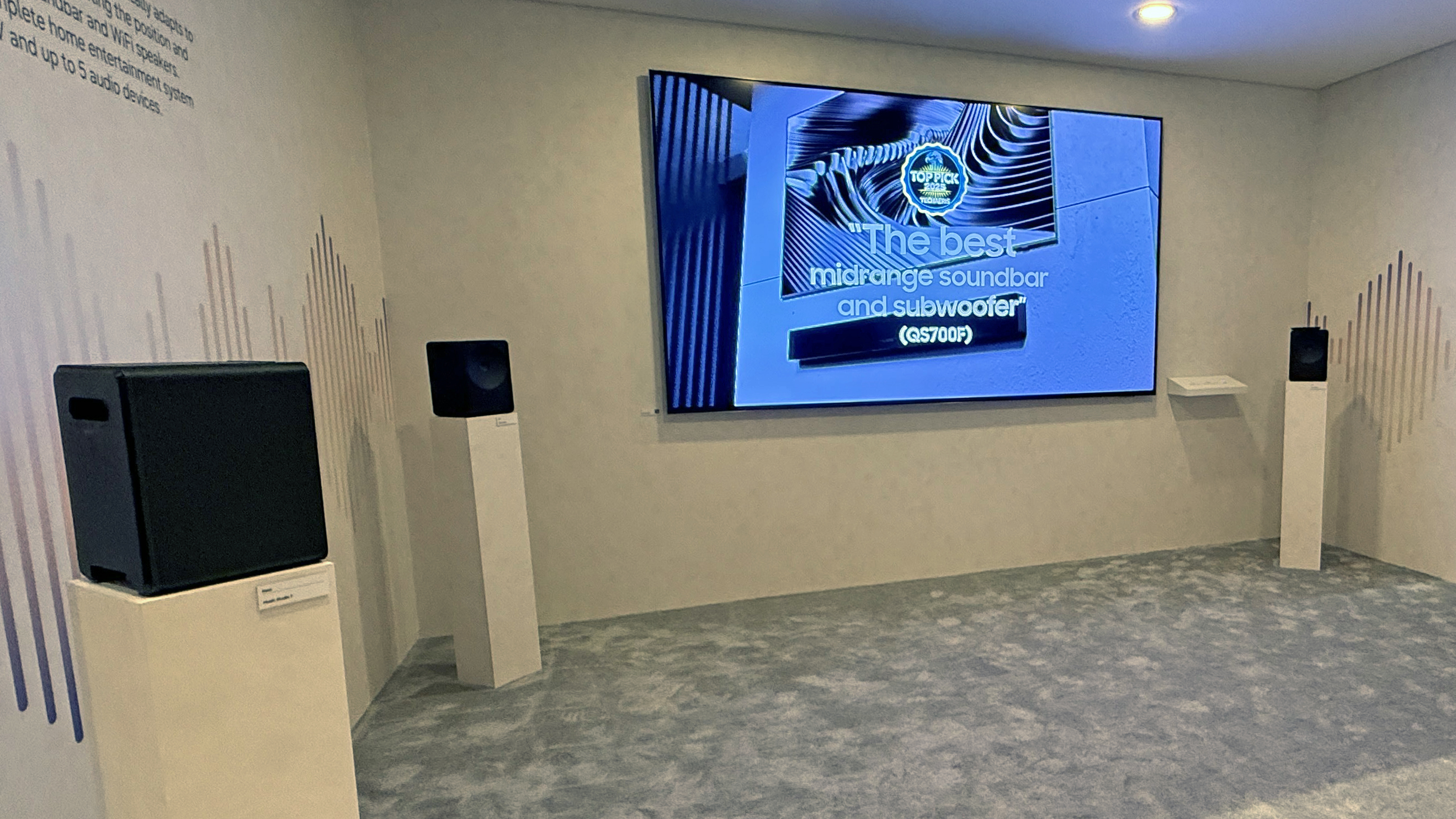 Samsung Music Studio 7 speakers arranged in a surround configuration facing a TV