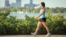 Woman walking in a city park