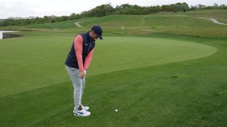PGA pro Alex Elliott demonstrating how to hit a chip and run shot around the green