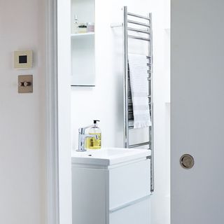 modern and compact bathroom with grey sliding door