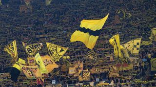 DORTMUND, GERMANY - OCTOBER 25: Borussia Dortmund fans on the Yellow Wall during the UEFA Champions League group G match between Borussia Dortmund and Manchester City at Signal Iduna Park on October 25, 2022 in Dortmund, Germany. (Photo by Visionhaus/Getty Images)