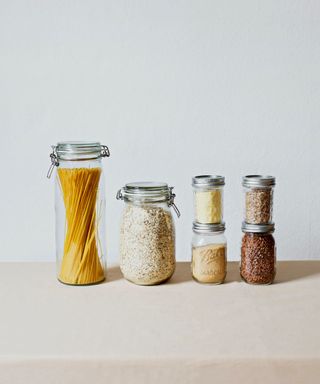 Glass jars with dried food goods inside