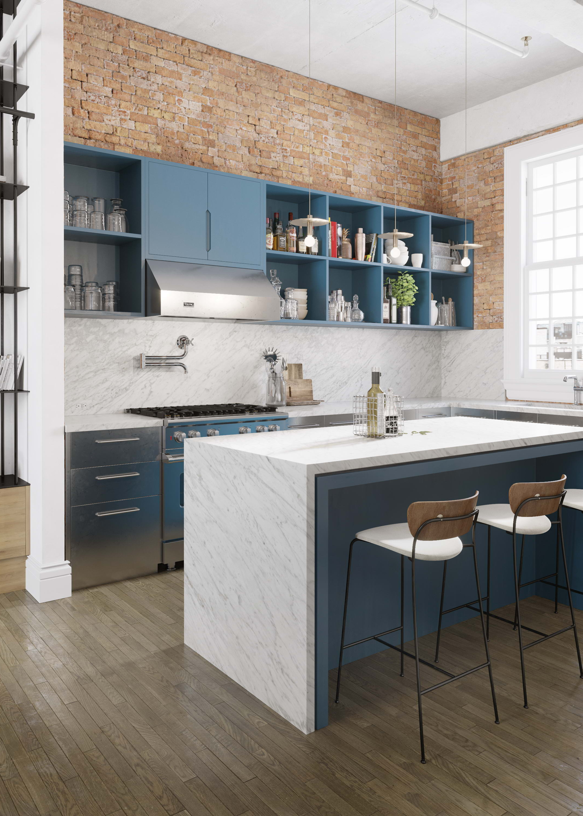 A small blue and white marble kitchen with an island in a converted warehouse looking building with red brick wall