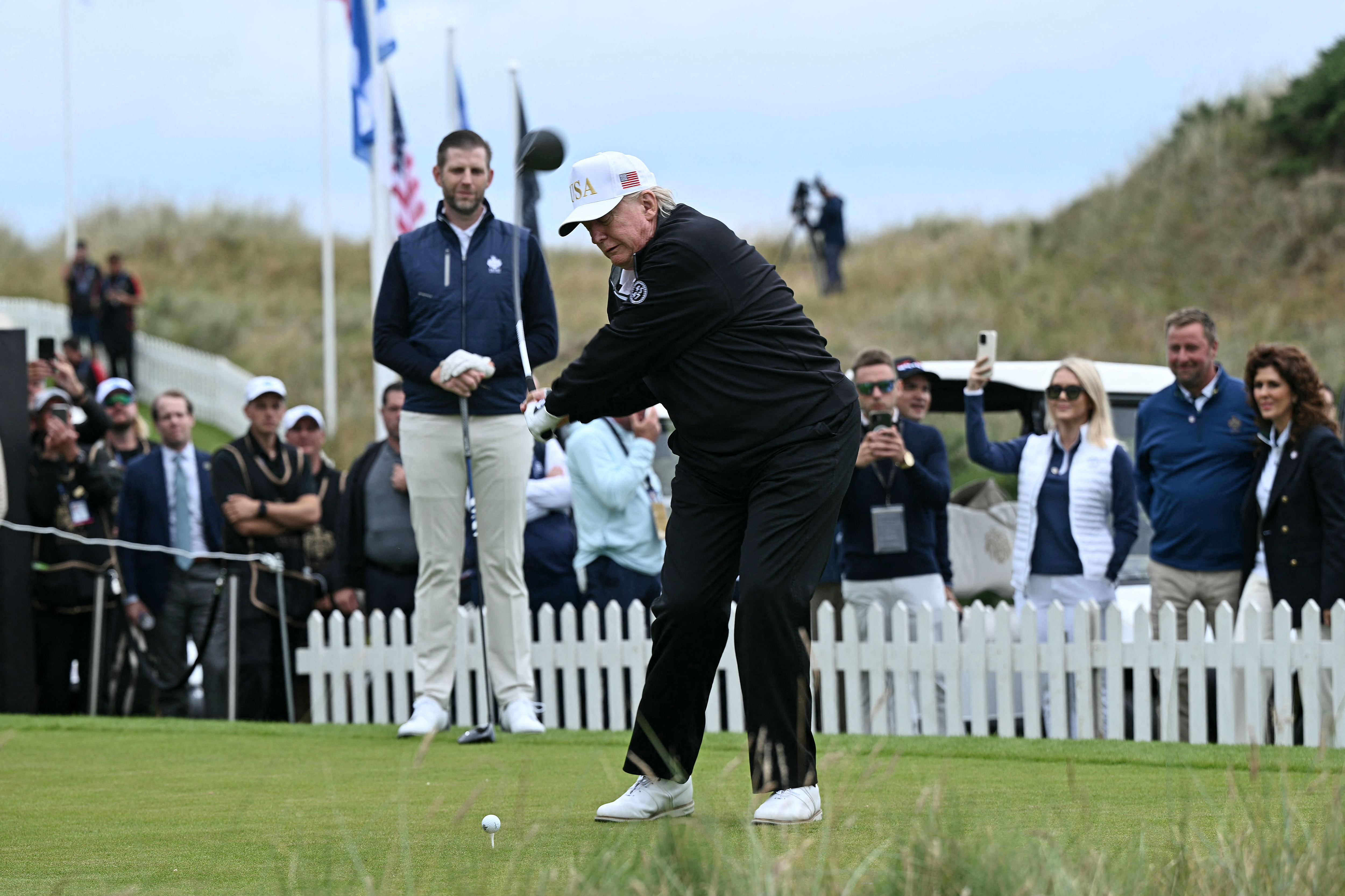 Donald Trump hits the ceremonial first tee shot at Trump International Golf Links, Scotland
