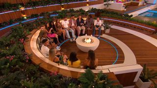The Winter Love Island 2023 contestants sitting around the firepit