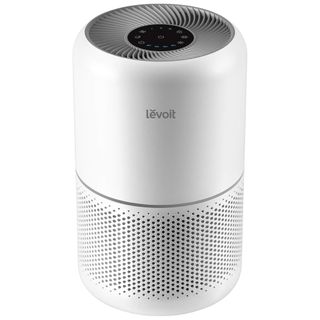 A white cylindrical air purifier