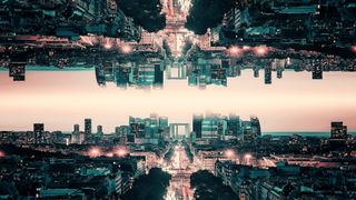 View of a cityscape with it's reflection above, depicting parallel worlds.