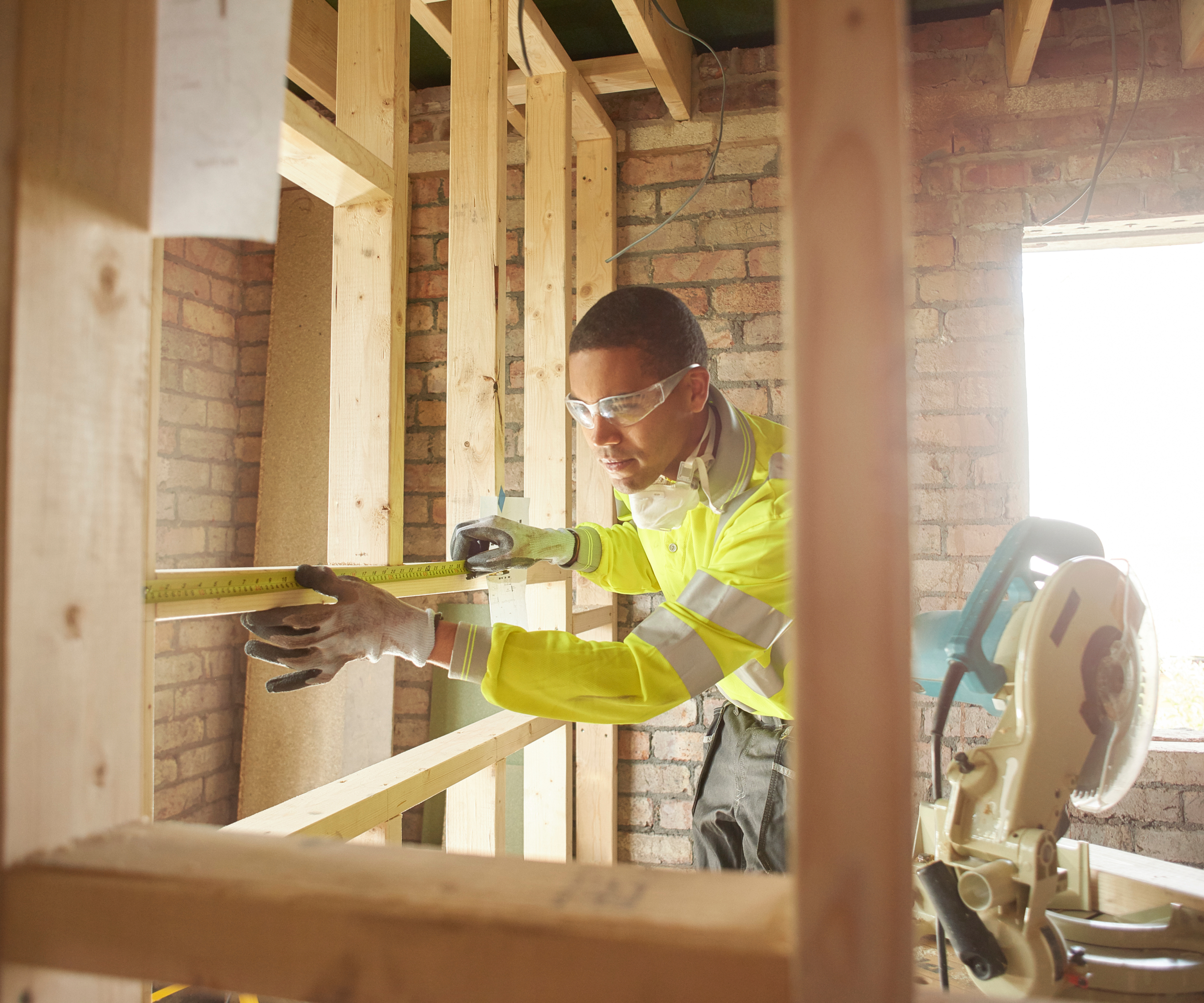 male worker building stud wall