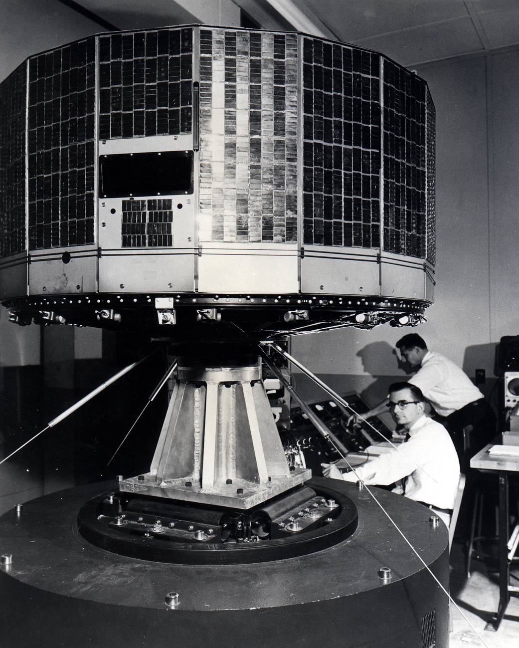 The TIROS-1 satellite, the first U.S. weather satellite, undergoes vibration testing at the at the Astro-Electronic Products Division of RCA in Princeton, New Jersey. It launched into orbit on April 1, 1960.
