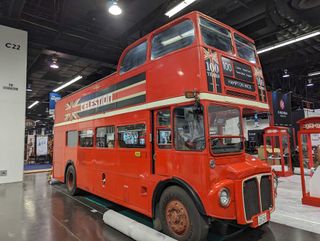 A bus celebrating Celestion's 100th anniversary on the floor of the 2024 NAMM show