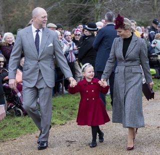 Mike Tindall and Zara Tindall with daughter Lena Tindall walking from church