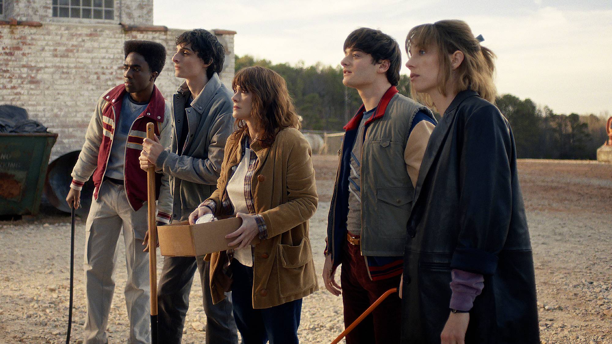 Caleb McLaughlin as Lucas Sinclair, Finn Wolfhard as Mike Wheeler, Winona Ryder as Joyce Byers, Noah Schnapp as Will Byers and Maya Hawke as Robin Buckley in 