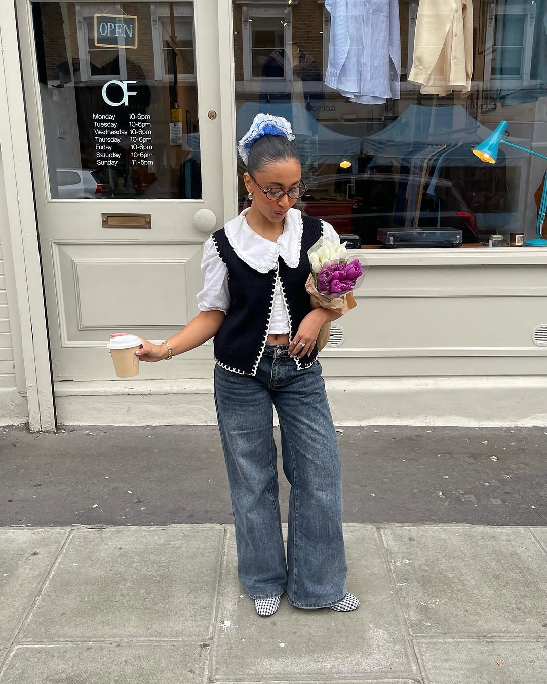 Woman wearing loose jeans and ballet flats.