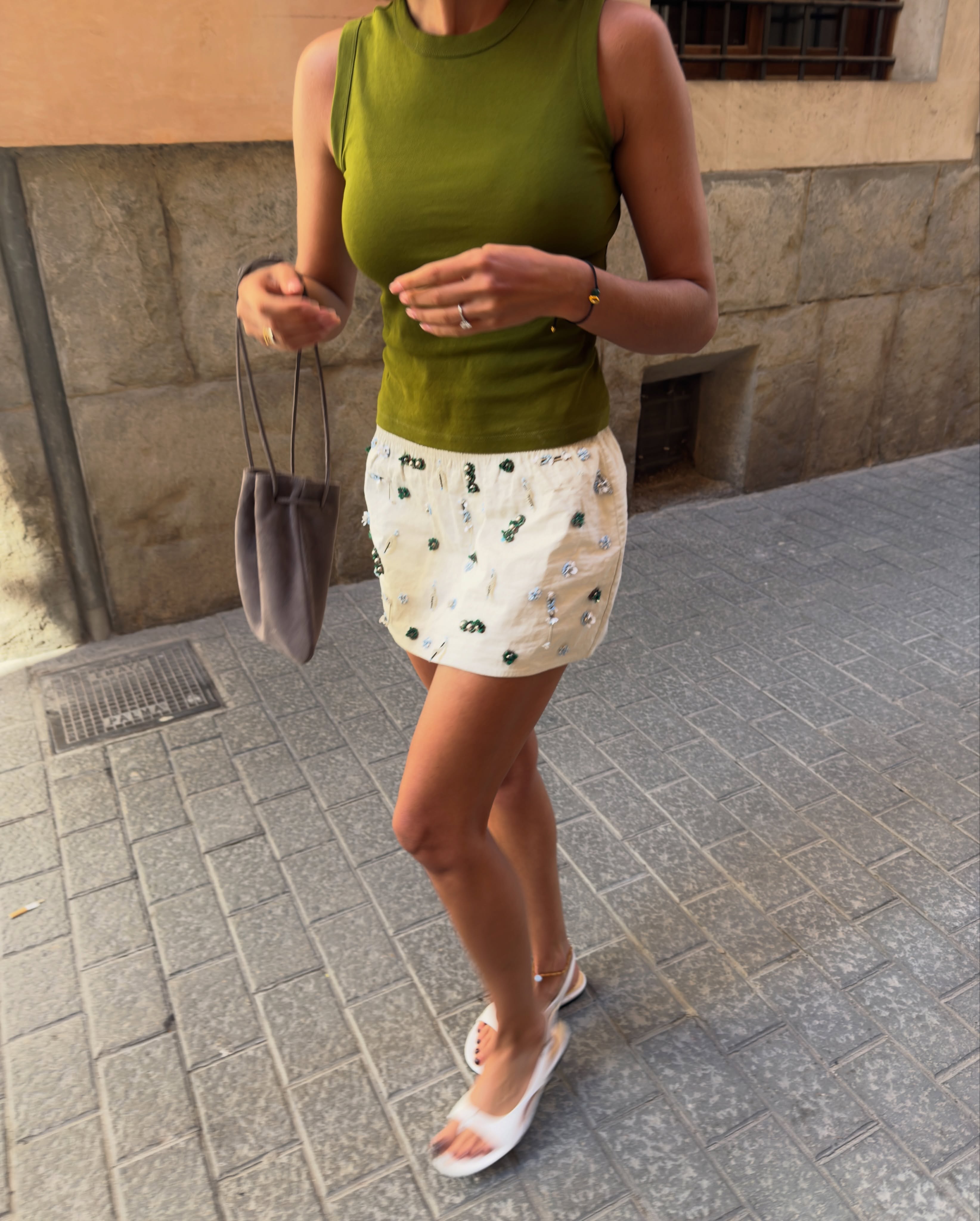 An image of a woman wearing green apple color trend summer 2026