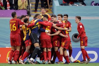 Spain's Alvaro Morata celebrates with his team-mates after scoring against Germany in the teams' World Cup clash.