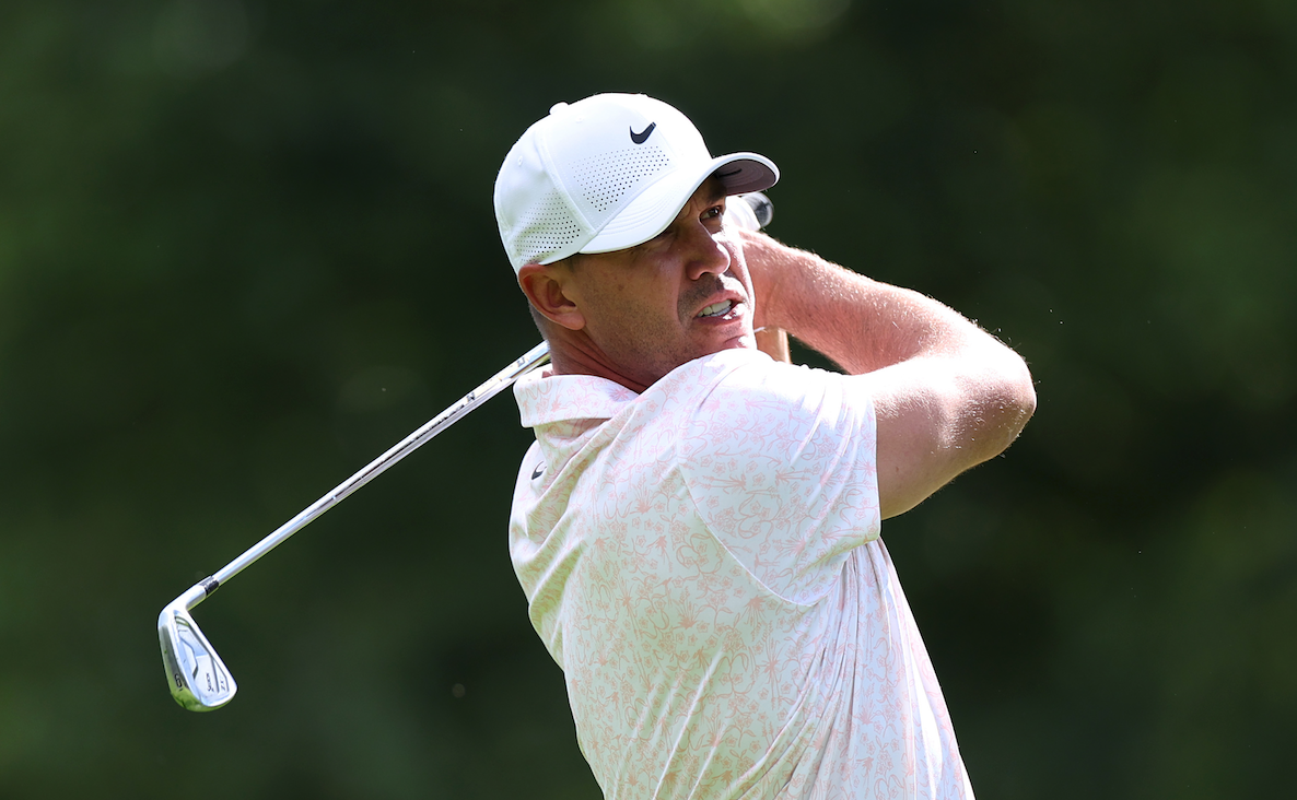 Brooks Koepka plays an iron shot