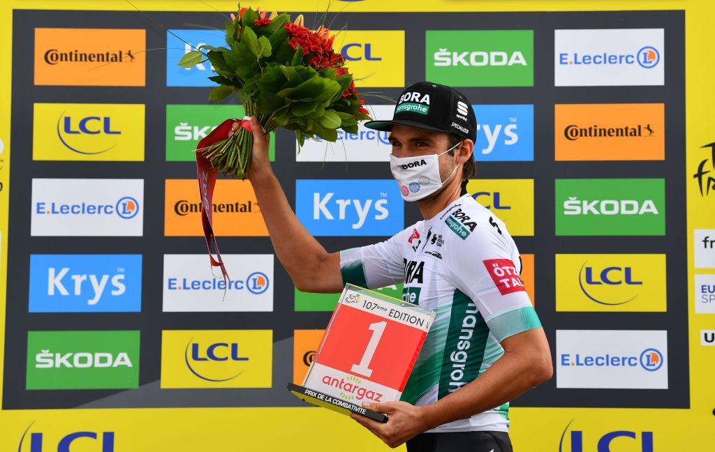Team Bora rider Germanys Maximilian Schachmann celebrates his combativity prize at the end of the 13th stage of the 107th edition of the Tour de France cycling race 191 km between ChatelGuyon and Puy Mary on September 11 2020 Photo by Stuart Franklin POOL AFP Photo by STUART FRANKLINPOOLAFP via Getty Images