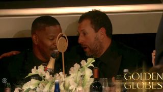 Jamie Foxx and Adam Sandler talking during Golden Globes