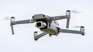A DJI drone in flight in the sky