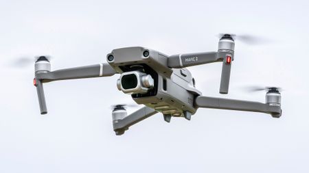 A DJI drone in flight in the sky