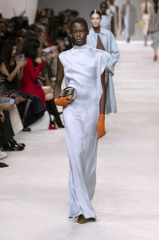The model is wearing a sky blue Fendi S/S '24 dress.