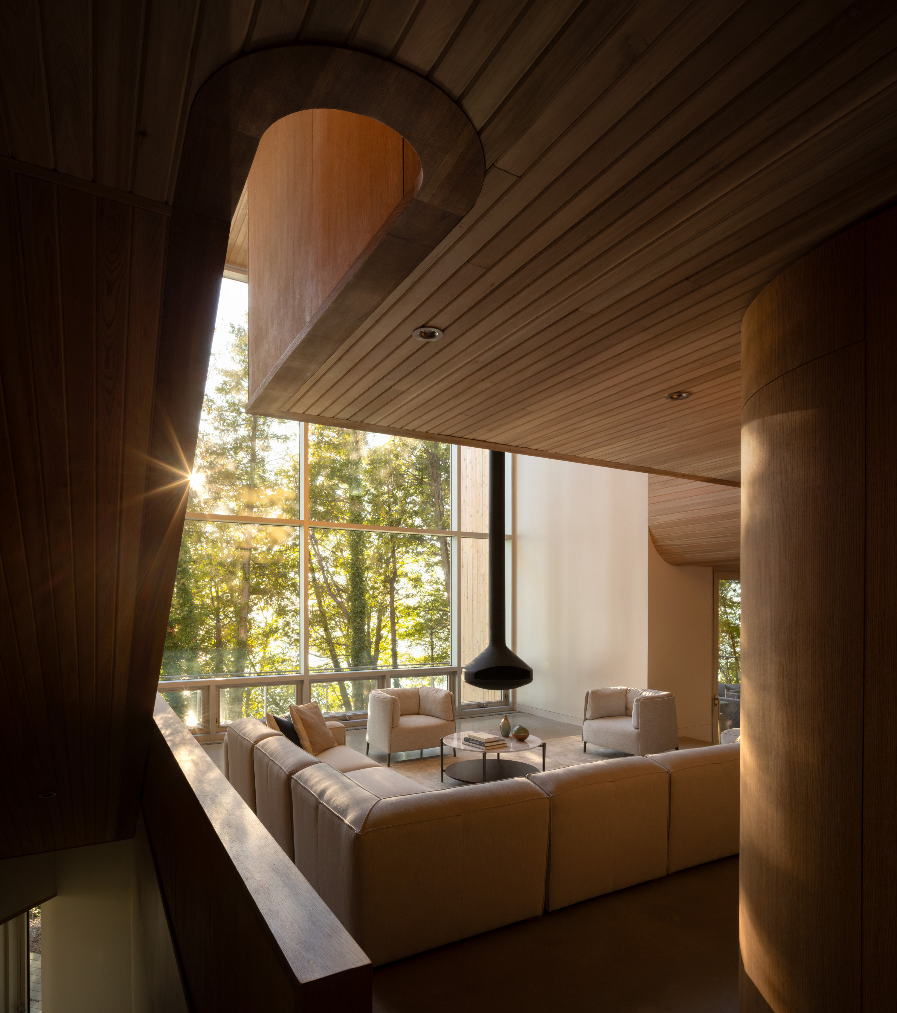 Another view of the main living space alongside the oak staircase